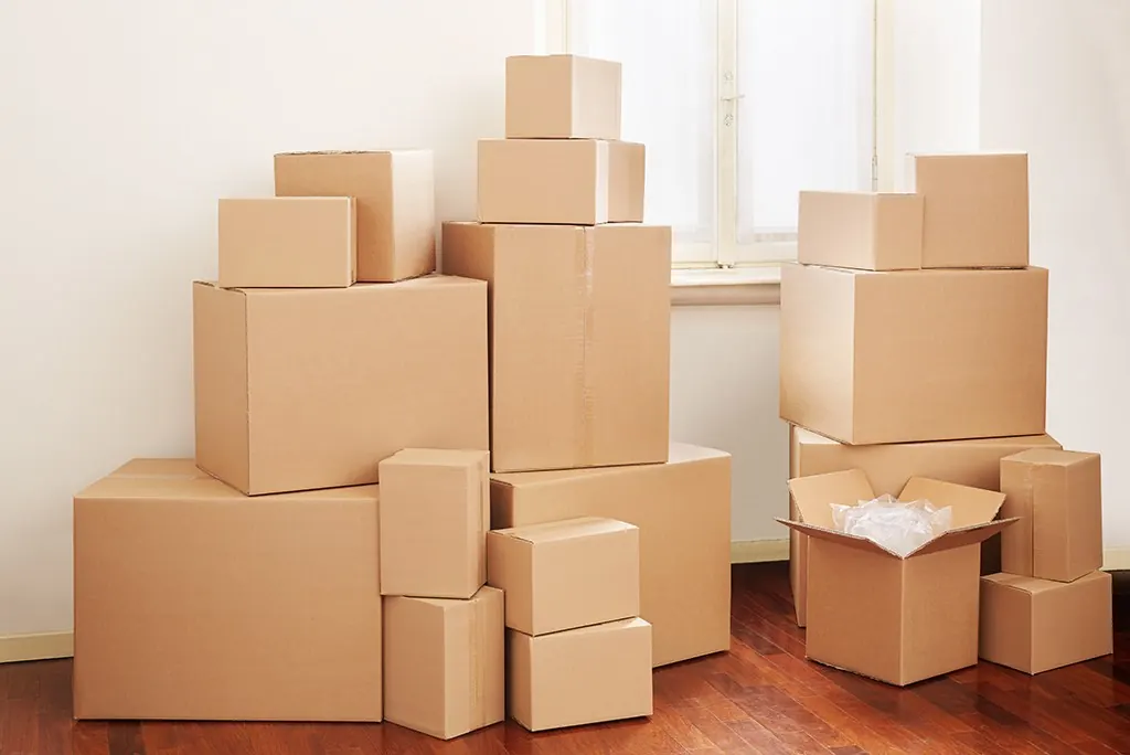 Stacked moving boxes in a room, ready for a move