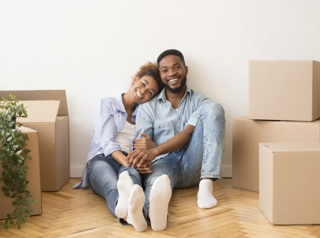 Couple settling into their new home among moving boxes